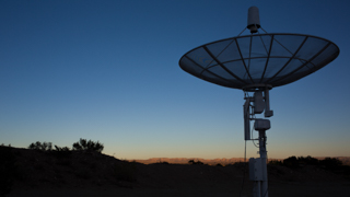 Radio telescope dish at sunset