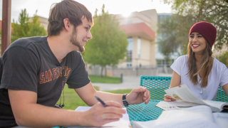 Students talking at a table